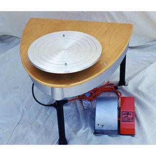 Bluebird Soldner Model S150 pottery wheel with blue wheel head and foot pedal, designed for ceramic artists and pottery making.