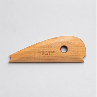 Garrity Tools Wooden Foot Tool 2, pottery rib with smooth wooden surface for shaping clay and pottery work.