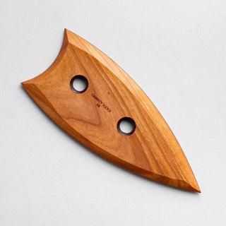 Garrity Tools Wooden Potters Rib S6 used for shaping and smoothing clay in pottery crafting.