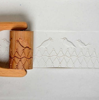 MKM RL 019 Large Handle Roller with birds on wire design, a pottery texture tool from MKM Pottery Tools, showing textured surface.