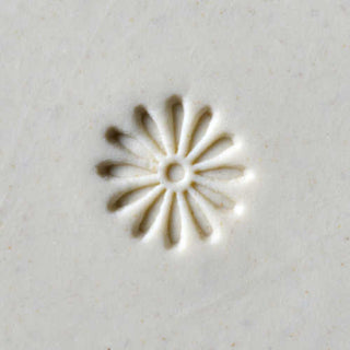 MKM SCS 004 Small Round Daisy Stamp for pottery texture tools, showing the detailed flower design on a rubber stamping surface.