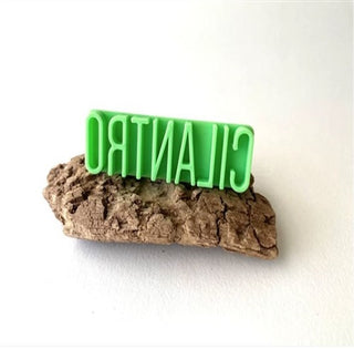 Moon Moon Ceramics letter stamp featuring the Cilantro design, a textured tool for pottery and ceramic surface decoration.