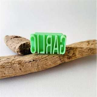 MoonMoon Ceramics garlic letter stamp from texture tools collection, showing detailed carved letter design for clay or ceramics projects.