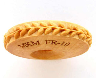 MKM FR 010 Finger Roller with vine, leaves, and flowers design, used as a texture tool for pottery and ceramic art.