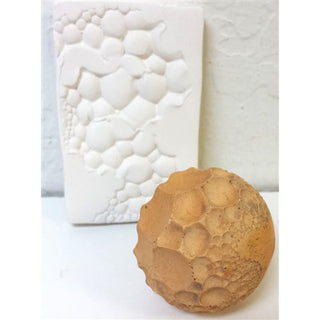 Olander Earthworks TS-1 Bubbles Moon Ball Texture Sphere, a round tool with bubble-like surface for artistic texturing.