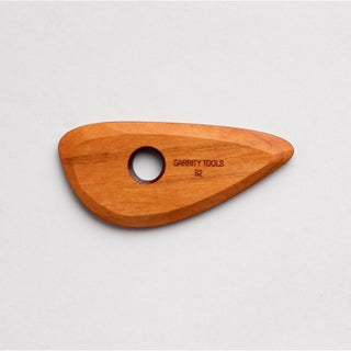 Garrity Tools Wooden Potters Rib B2, a handcrafted ceramic shaping tool with smooth wooden surface and ergonomic design.