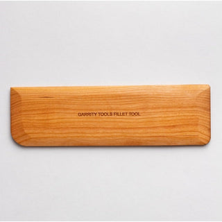 Garrity Tools Fish Fillet Tool Potters Rib with wooden handle, used for shaping and smoothing pottery surfaces.