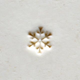 MKM SMR 064 Mini Round Stamp with snowflake design, used as a texture tool for pottery and clay crafting.