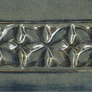 Amaco PC-67 River Rock ceramic glaze chip showing a 6x6 label tile with a natural stone-like glaze finish.