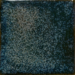 Coyote Glazes ceramic glaze in Smokey Pearl, showing a smooth, glossy finish on a pottery tile surface.