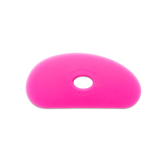 Small pink polymer potters rib with ribbed edge from Sherrill Mudtools, designed for shaping clay in pottery.