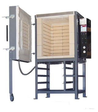 Open door of Olympic FL-10 front loading electric kiln showing interior chamber and heating elements.