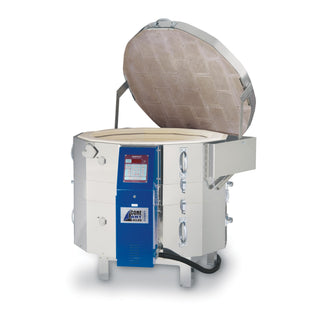 White 22-inch tall Tucker's Cone Art BX2822D pottery kiln with digital controls and insulated exterior.